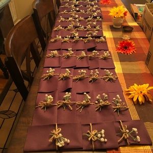 50 Large , Plum, Linen feel but disposable Napkins w/ Baby’s breath and twine.